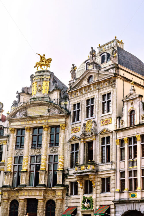 City buildings facade at Grand Place in a sunny day. Bright clear sky on background. Negative copy space, place for text. Brussels, Belgium - Starpik