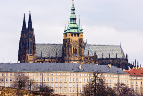 Close-up view to Cathedral of St. Vitus, a part of the castle. Cloudy day. Negative copy space, place for text. Prague, Czech Republic - Starpik