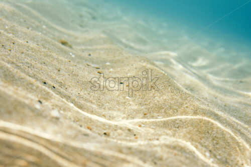 Closeup shot to the underwater sand. Negative copy space, place for text. Nissi Beach, Ayia Napa, Cyprus. - Starpik