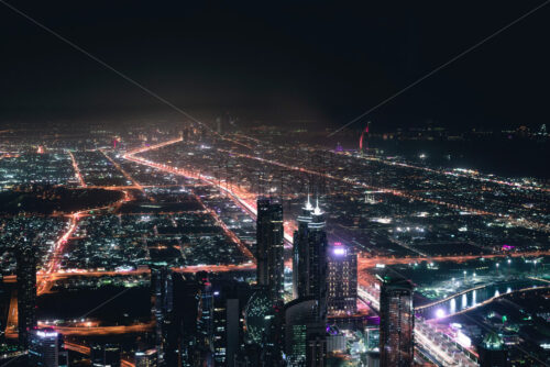 Colourful view of Dubai, United Arab Emirates. Aerial view on highways and skyscrapers. Wide angle shot of the cityscape - Starpik