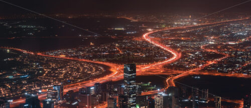 Colourful view of Dubai, United Arab Emirates. Aerial view on highways and skyscrapers. Wide angle shot of the cityscape - Starpik