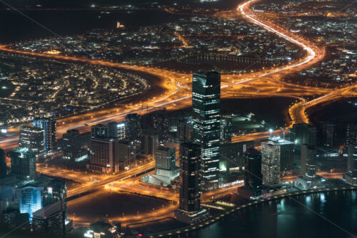 Colourful view of Dubai, United Arab Emirates. Aerial view on highways and skyscrapers. Wide angle shot of the cityscape - Starpik