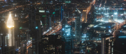 Colourful view of Dubai, United Arab Emirates. Aerial view on highways and skyscrapers. Wide angle shot of the cityscape - Starpik