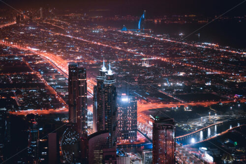 Colourful view of Dubai, United Arab Emirates. Aerial view on highways and skyscrapers. Wide angle shot of the cityscape - Starpik