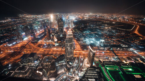 Colourful view of Dubai, United Arab Emirates. Aerial view on highways and skyscrapers. Wide angle shot of the cityscape - Starpik