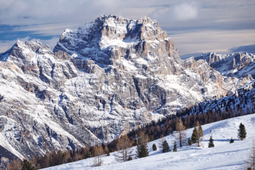 Cortina Ampezzo ski resort mountains covered in snow at sunset. Province of Belluno, Italy - Starpik