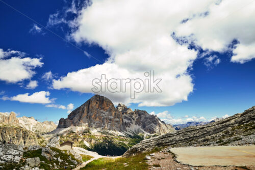 Cortina d’Ampezzo mountains at daylight. Cloudy sky on background. Italy - Starpik