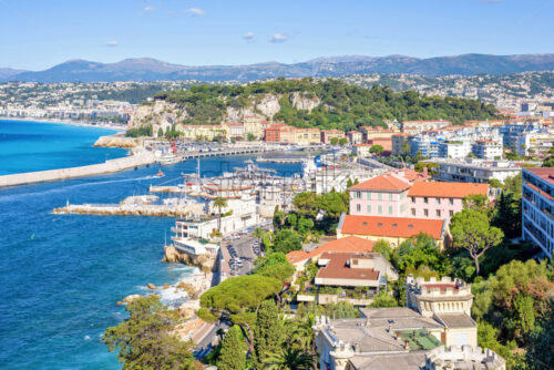 Daylight sunny view to city buildings and bright blue sea - Starpik