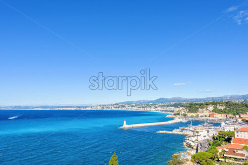 Daylight view to beachline and blue sea of Antibes, France - Starpik