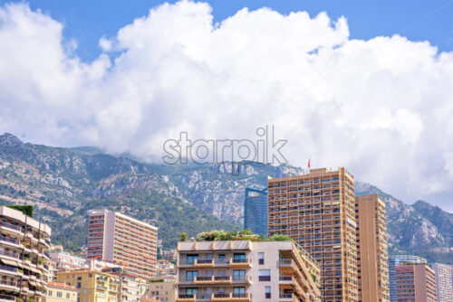 Daylight view to city buildings, mountains and sky of Monaco - Starpik