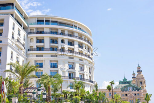 Daylight view to round shape hotel building facade with ornaments - Starpik