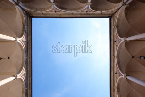 Doria Tursi Palace backyard. Abstract view from bottom to blue sky. Genoa, Italy - Starpik