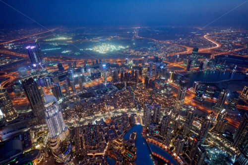 Dubai Cityscape at sunset blue hour from tallest building view. United Arab Emirates - Starpik