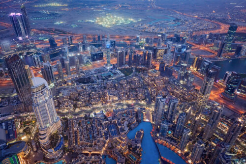 Dubai Cityscape at sunset blue hour from tallest building view. United Arab Emirates - Starpik