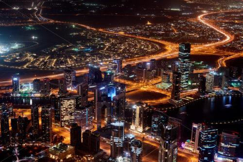 Dubai Cityscape at sunset blue hour from tallest building view. United Arab Emirates - Starpik