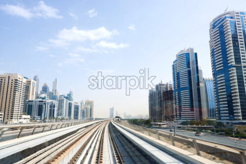 Dubai Metro rail road at daylight. United Arab Emirates - Starpik