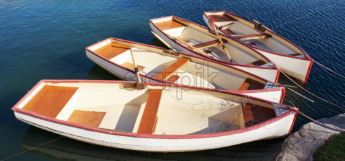 Empty boats on the shore of pond. Palace of Fountainebleau Estate, France - Starpik