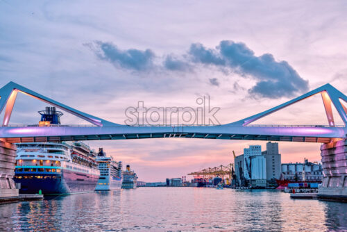 Europa Bridge at the entrance to Port Vell Barcelona, Catalunya Spain. Beautiful peaceful view sunset - Starpik