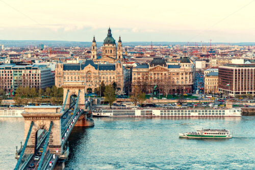 Famous chain bridge and Danube river with ships at sunset. Aerial view. Negative copy space, place for text. Budapest, Hungary - Starpik