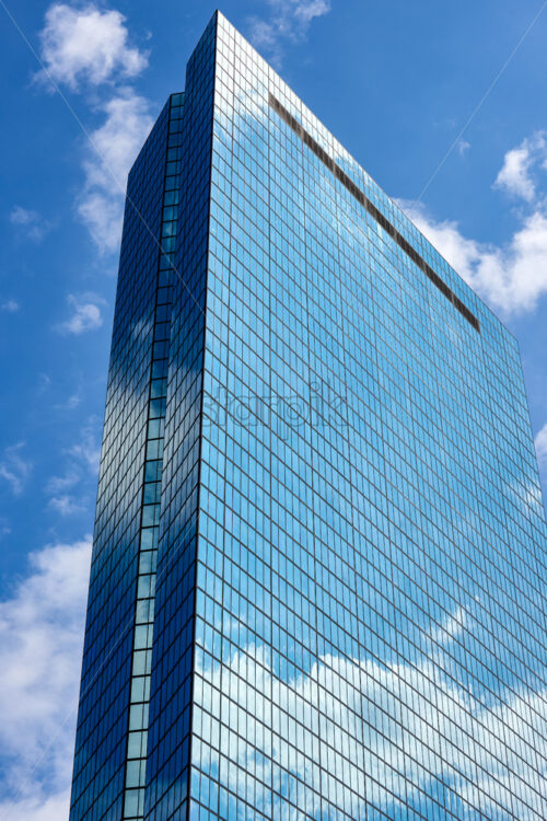 Glass tower with blue sky reflection. John Hancock building in Boston, Massachusetts – USA - Starpik