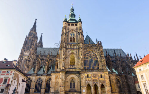 Gothic architectured St. Vitus Cathedral from bottom in a sunny day. Negative copy space, place for text. Prague, Czech Republic - Starpik