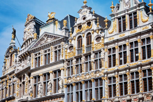 Grand place in Brussels with golden ornaments and blue sky, Belgium - Starpik