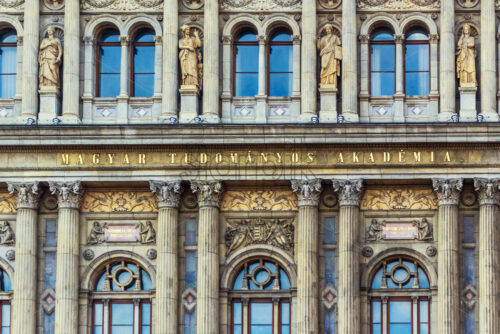 Hungarian Academy of Sciences with close-up at the name. Sunset light reflecting on windows. - Starpik