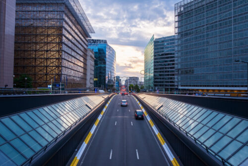 Long exposure shot from a bridge in Brussels. Traffic tunel and Europen headquarters in the foreground - Starpik