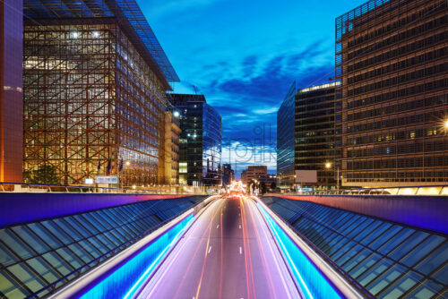 Long exposure shot of a central street at blue hour. Skyscrapers on background. Brussels, Belgium - Starpik