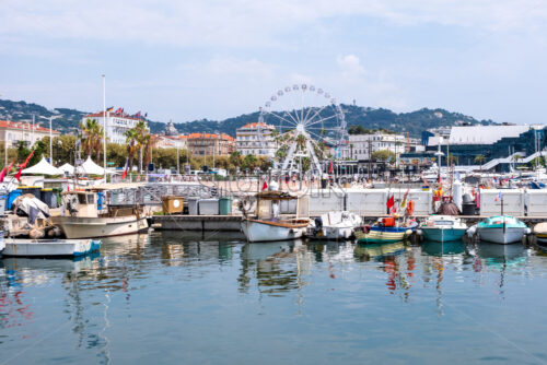 Lots of boats in the sea port of Cannes. Fishing in France. A few clouds in the sky - Starpik