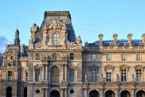 Louvre Museum facade at sunset. Place for text. Paris, France - Starpik