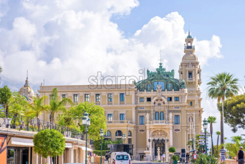 MONACO, FRANCE – JUNE 28, 2017: Beautiful daylight view to a museum in town. People walking on sidewalk and  cars parked on road - Starpik