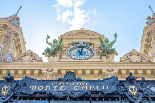 MONACO, FRANCE – JUNE 28, 2017: View from bottom to Monte-Carlo Casino facade with classic ornaments. Bright blue sky with clouds on background. - Starpik