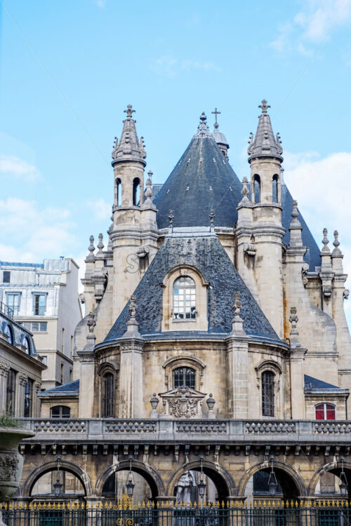 Medieval castle in the center of Paris. View throw a window. Shiny day with some clouds in the sky. Bright sunlight - Starpik