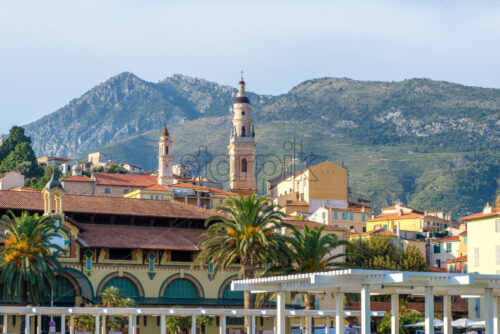 Menton city at sunset. Church and mountains on background. France beauties - Starpik