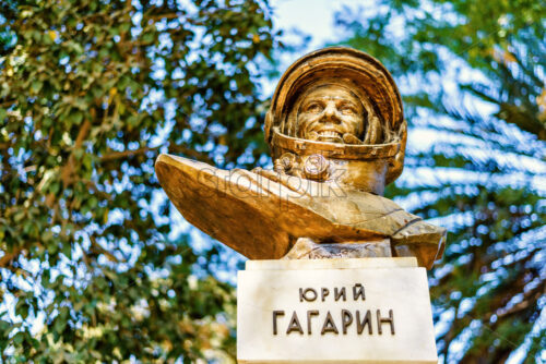 NICOSIA, CYPRUS – SEPTEMBER 14, 2017: Daylight view from bottom to Yuri Gagarin monument. Trees and bright blue clear sky on background. - Starpik