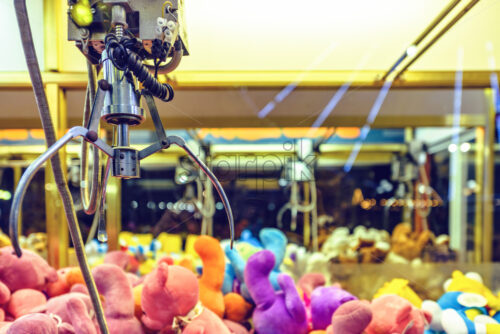 Night view to claw machine full of colorful soft toys. Lights glowing on glass. Ayia Napa, Cyprus - Starpik