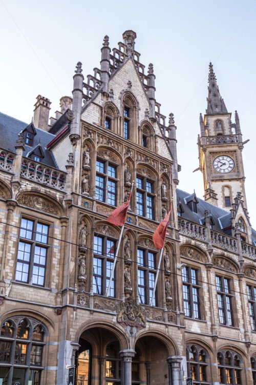 Old Post Office in the Korenmarkt at sunset. View from bottom. Blue sky on background. Ghent, Belgium - Starpik