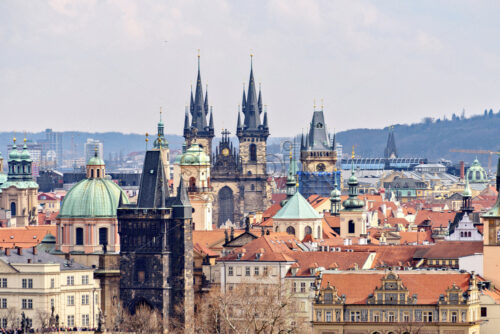 Old city buildings and famous castle from above in a cloudy day. Miniature style photography. Negative copy space, place for text. Prague, Czech Republic - Starpik