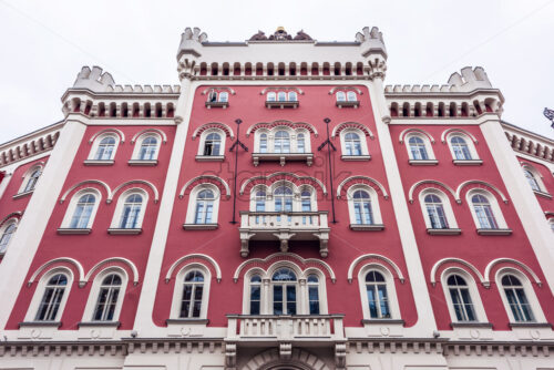 Old red gothic style buildings with windows reflecting clouds. Negative copy space, place for text. National Square, Prague, Czech Republic - Starpik