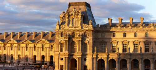 PARIS, FRANCE – OCTOBER 03, 2018: Louvre Museum facade at sunset. Wide panoramic shot - Starpik