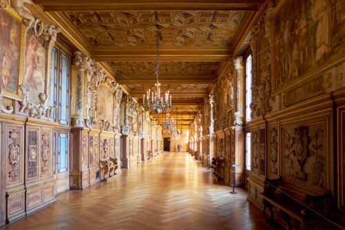 PARIS, FRANCE – SEPTEMBER 09, 2018: Gallery of Francis I in orange and teal colors. The Palace of Fontainebleau - Starpik