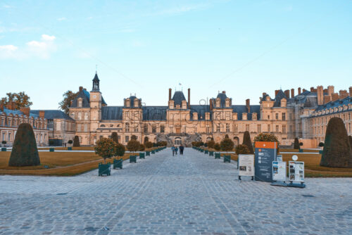 PARIS, FRANCE – SEPTEMBER 09, 2018: The Palace of Fontainebleau at daylight. People walking in front. Orange and teal colors - Starpik