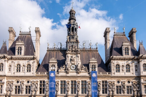 PARIS, FRANCE – SEPTEMBER 28, 2018: Close up shot to Hotel de Ville. Blue sky with soft clouds and shadows on the building. Horizontal shot - Starpik