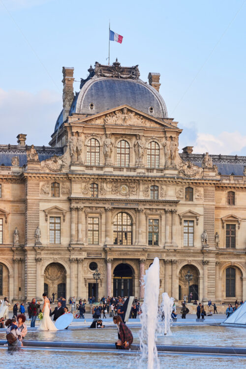 PARIS, FRANCE – SEPTEMBER 28, 2018: Pavillon Sully in Palace of Versailles yard. People walking in front - Starpik