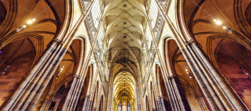 PRAGUE, CZECH REPUBLIC – MARCH 23, 2018: Gothic architecture interior roof of St. Vitus Cathedral with stained glass - Starpik