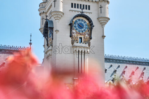 Palace of Culture at daylight. Flowers on foreground. Close-up shot. Iasi, Romania - Starpik