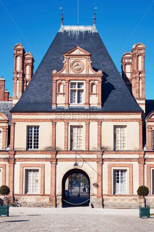 Palace of Fontainebleau facade at daylight. Paris, France - Starpik