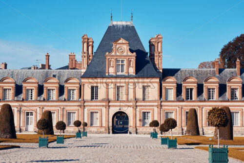 Palace of Fontainebleau facade at daylight. Paris, France - Starpik