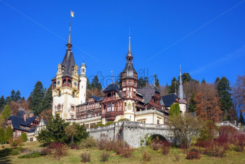 Peles Castle at daylight. Clouds on background. Wide shot. Sinaia, Romania - Starpik